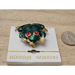 Vintage Frog‎ fashion Brooch with red rhinestone eyes.